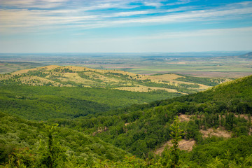 Naklejka premium landscape with green hills and blue sky