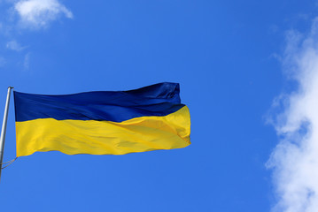 Large national flag of Ukraine flies in the sky. Big yellow blue Ukrainian state flag in the Dnepr city, Independence, Constitution, Defender s Day, National Holiday