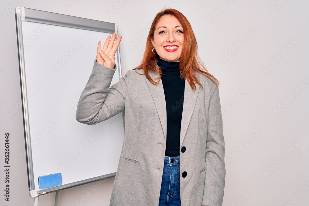 Poster Young beautiful redhead businesswoman doing business presentation using magnetic board showing and pointing up with fingers number four while smiling confident and happy.