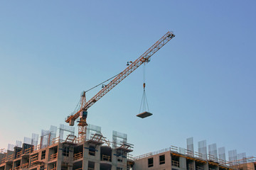 Fototapeta na wymiar Industrial construction cranes the construction of an building
