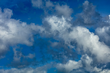 Blue sky with rayny clouds high angle view