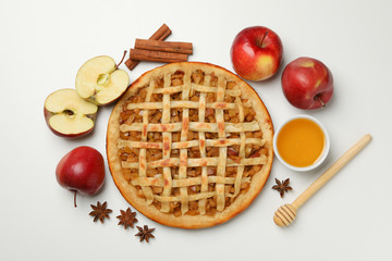 Composition with tasty apple pie on white background, top view