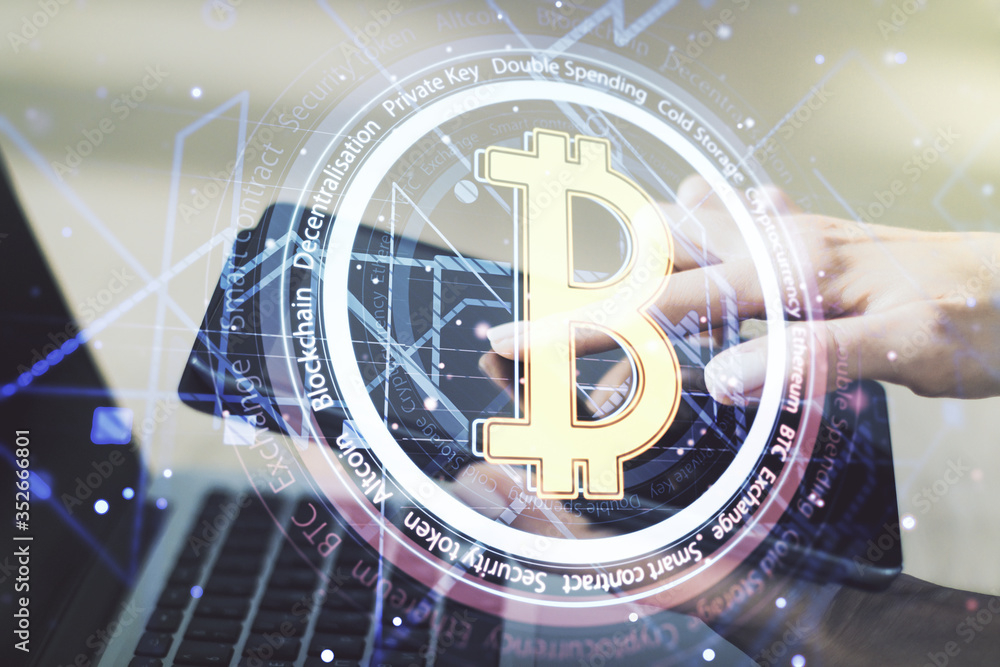 Poster double exposure of creative bitcoin symbol hologram and hand working with a digital tablet on backgr