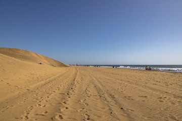 summer desert landscape on a warm sunny day from Maspalomas dunes on the Spanish island of Gran Canaria