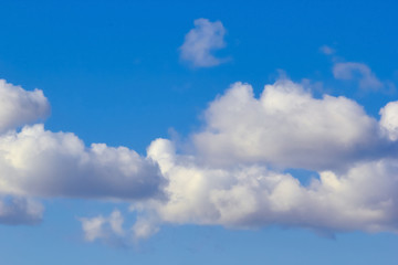 texture of fluffy clouds against a blue sky and fresh air