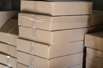 Sealed cardboard boxes in stock. Boxes are being prepared for shipment.
