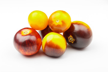 Background made from different tomatoes, white background