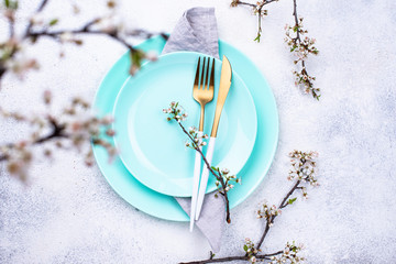Spring table setting with blooming branch