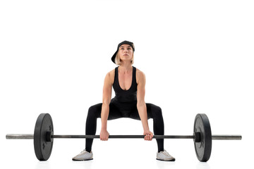 Fototapeta na wymiar Young woman doing deadlift with a barbell isolated on white. Front view
