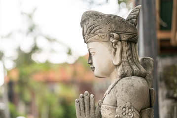 Fototapeta na wymiar Religious Balinese statue in the street
