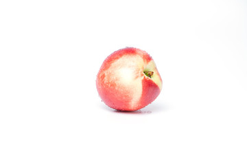 ripe peach with drops of water, isolate on white