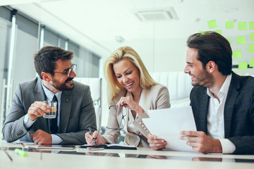 Shot of a group of businesspeople sitting together in a meeting