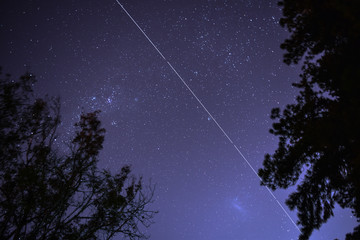 International Space Station and Large Magellanic Cloud in a night landscape - Powered by Adobe