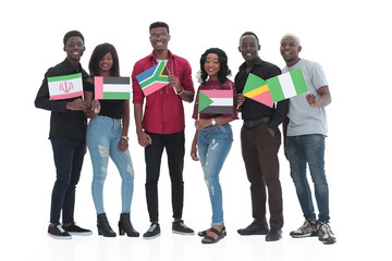 Obraz premium in full growth. group of diverse young people with national flags.