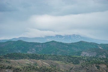 Fototapeta na wymiar clouds over the mountains