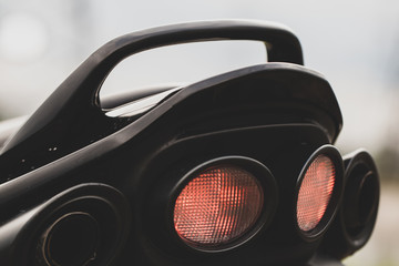 Sports black motorcycle near the power plant.