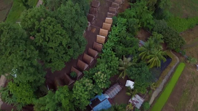 Aerial Top Down Shot of Pi, Thailand. Reveal of Village and Tropical Landscape