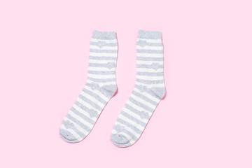 One pair of Women's socks on a colored background