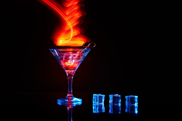 Neon martini glass shot with long exposure. Red club lights.