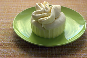 
Delicate homemade handmade straccella cheese on a light green plate. Fine Italian dish