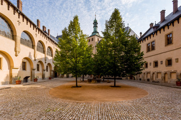 Fototapeta na wymiar In the courtyard of the royal palace. Historic houses in the center of Kutna Hora in the Czech Republic, Europe. UNESCO World Heritage Site.