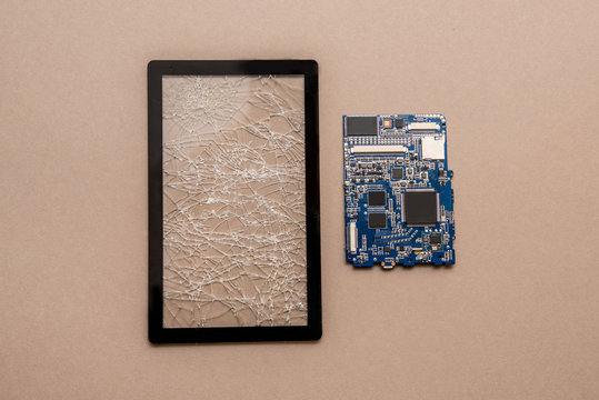 Mobile phone tempered glass screen protector. Broken glass screen phone, tablet. Phone board. Service center for the replacement of glass phone and tablet