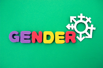 colored letters gender with symbols on green background