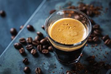 Fresh espresso served in cup on table