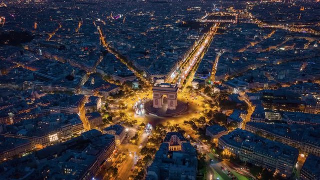 twilight time illumination paris city center triumph arch traffic circle street aerial timelapse panorama 4k france