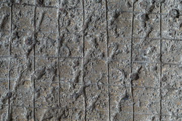 Cobblestone texture.Marble and granite drainage system closeup.Concrete wall with gravel. Gray foundation of the house.