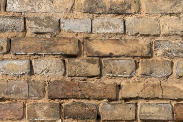 Empty background, texture, brick wall of the old building. Beautiful vintage view.