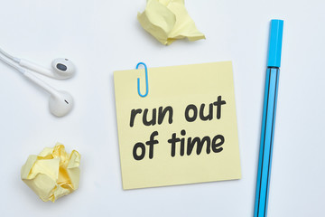 Run out of time - english idiom hand lettering on wooden blocks