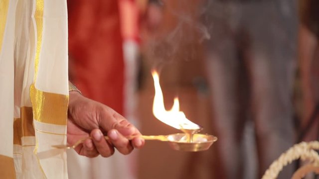 Wedding ceremony, traditional indian hindu marriage ritual with red flowers and attributes