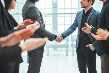 business team applauding at a meeting with business partners
