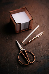 Vintage style office utensils. Scissors, pen, pencil and notes