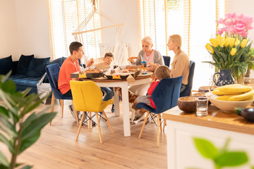 Family eating pizza at home.