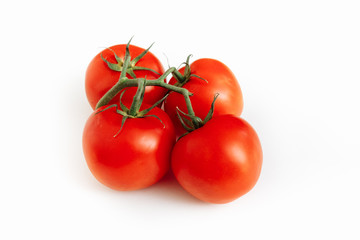 A branch with three tomatoes. Isolated on white