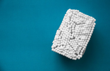 packaging of ear sticks on a blue background. hygiene and care