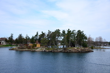 Fototapeta na wymiar Thousand Islands area of Saint Lawrence River in the board of USA and Canada