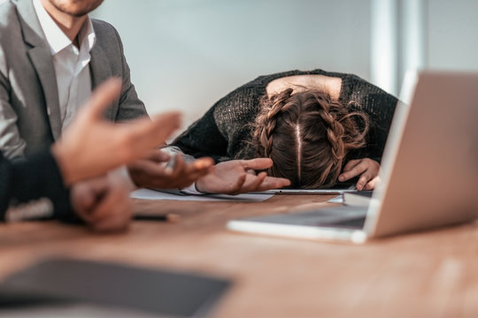 tired young businesswoman fell asleep during a group meeting
