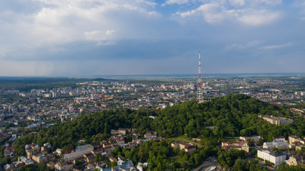 Closeup of television tower in Lviv. Summer aerial drone view in june 2019. Mountain Vysokyi Zamok in Lviv, Ukraine.