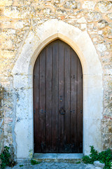 Fototapeta na wymiar Closed wooden door of medieval fortress in Europe