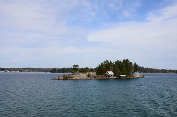 Fototapeta na wymiar One Island in Thousand Islands Region in fall of New York State, USA