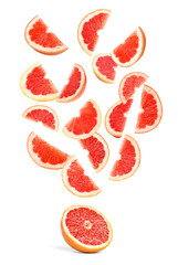 Slices of juicy grapefruit on white background