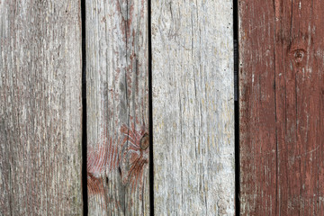 Dark grey and red weathered wooden background.