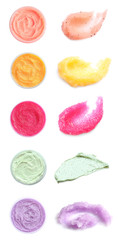 Set with different samples and containers of natural scrubs on white background, top view