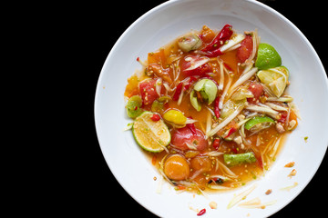 Plate of Papaya salad  After eating food isolated on black background, dishes have not been cleaned.
