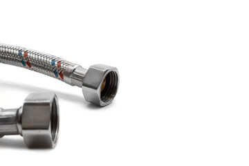 Cable metal hose on white background for supplies Water heater. Close-up. Isolated on white background.