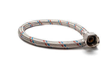 Cable metal hose on white background for supplies Water heater. Close-up. Isolated on white...