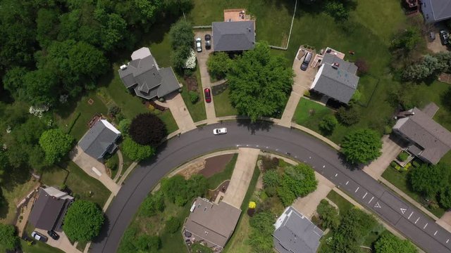 A slow summer aerial straight down flyover establishing shot of a typical Western Pennsylvania residential neighborhood. Pittsburgh suburbs.  	